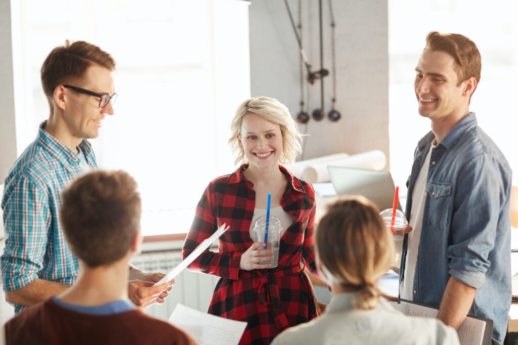 Blonde Young Woman in Group Meeting